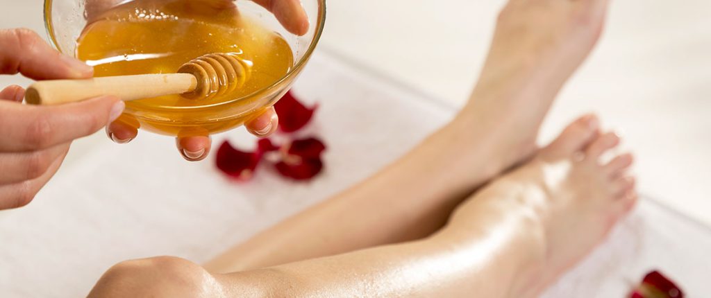 Wax being applied to woman's legs