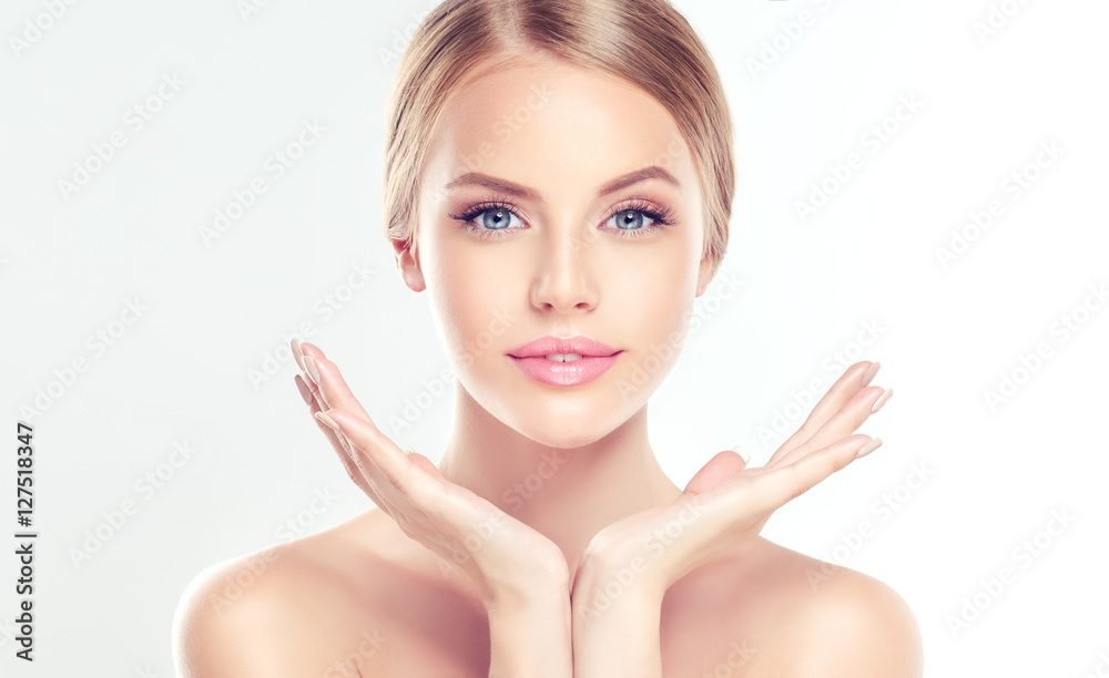 Woman with clear skin and hands up